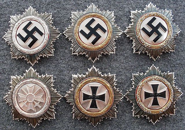 German Cross in Silver, Gold, and with Diamonds. Post-war denazified versions shown below.