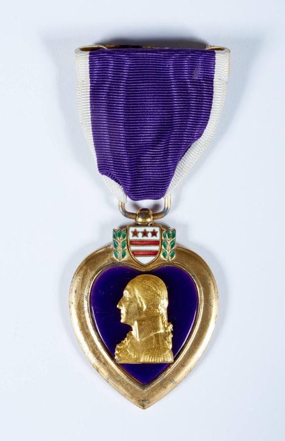 The Purple Heart Medal was presented to J. G. Lieutenant John F. Kennedy for his service in WWII.