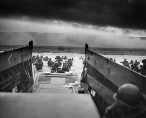 The 16th Infantry Regiment, US 1st Infantry Division wading ashore from their landing craft. 6 June 1944.